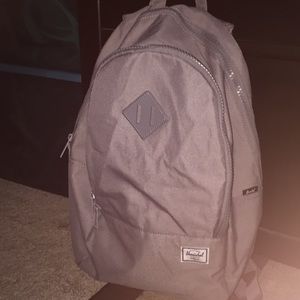 grey herschel backpack with a laptop compartment